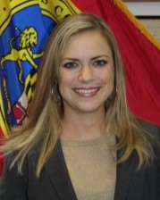 Headshot of County Attorney Buffy Giddens standing in front of the St. Mary's County flag.